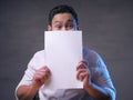 Happy Smiling Businessman Covering His Face With Blank Paper Card Royalty Free Stock Photo