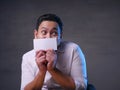 Happy Smiling Businessman Covering His Face With Blank Paper Card Royalty Free Stock Photo