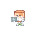 Happy smiling candle in glass cartoon character working with laptop