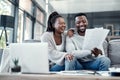 Happy, smiling and carefree black couple checking their finances on a laptop at home. Cheerful husband and wife excited Royalty Free Stock Photo