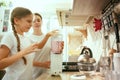 The happy smiling caucasian family in the kitchen preparing breakfast Royalty Free Stock Photo