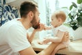 The happy smiling caucasian family in the kitchen preparing breakfast Royalty Free Stock Photo