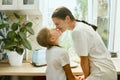 The happy smiling caucasian family in the kitchen preparing breakfast Royalty Free Stock Photo