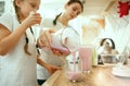 The happy smiling caucasian family in the kitchen preparing breakfast Royalty Free Stock Photo