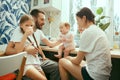 The happy smiling caucasian family in the kitchen preparing breakfast Royalty Free Stock Photo