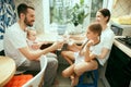 The happy smiling caucasian family in the kitchen preparing breakfast Royalty Free Stock Photo