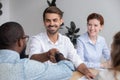 Happy smiling caucasian male manager shaking hand african-american colleague Royalty Free Stock Photo