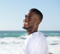 Happy smiling cheerful young man at the beach Royalty Free Stock Photo
