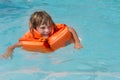 Happy smiling child girl in inflatable life-jacket Royalty Free Stock Photo