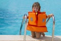 Happy smiling child girl in inflatable life-jacket Royalty Free Stock Photo