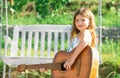 Happy smiling child girl play the guitar. Dreamy kids face. Smiling child playing outdoors in summer. Royalty Free Stock Photo