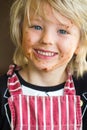 Happy, smiling child with messy chocolate face