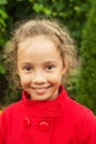 Happy smiling child in red jacket outdoors Royalty Free Stock Photo