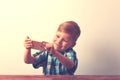 Happy smiling child with smartphone in hands Royalty Free Stock Photo
