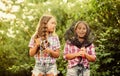 Happy smiling children with net and rod. Happy childhood. Adorable girls nature background. Teamwork. Camping activities