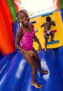 Happy smiling children playing on an inflatable bounce house Royalty Free Stock Photo