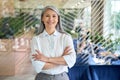 Happy confident senior Asian businesswoman standing in modern office. Portrait. Royalty Free Stock Photo