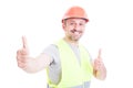 Happy smiling constructor or builder showing double like sign