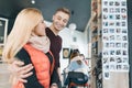 Happy smiling couple embracing in coffee shop in autumn winter season Royalty Free Stock Photo