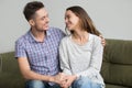 Smiling couple looking at each other reconciled after quarrel Royalty Free Stock Photo
