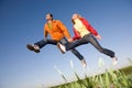 Happy smiling couple jumping Royalty Free Stock Photo