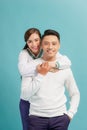 Happy smiling couple in love. Over blue background Royalty Free Stock Photo