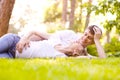 Happy Smiling Couple Relaxing on Green Grass Royalty Free Stock Photo