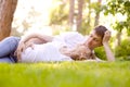 Happy Smiling Couple Relaxing on Green Grass Royalty Free Stock Photo