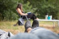 Happy smiling couple relaxing on green grass Royalty Free Stock Photo