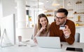 Happy smiling couple shopping online at home. Technology, e-commerce concept. Royalty Free Stock Photo