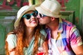 Happy smiling couple in sunglass and hat with guitar drinking j Royalty Free Stock Photo