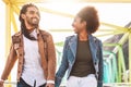 Happy smiling couple walking in city - Young lovers having fun dating outdoor Royalty Free Stock Photo