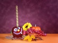 Happy smiling crazy faceHalloween red toffee apple candy