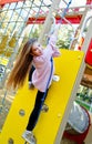 Happy smiling cutu little girl child on playground equipment Royalty Free Stock Photo