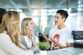 Happy and smiling design team talking while having a casual chat in a modern office. Diverse group of designers