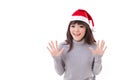 happy, smiling, exited woman wearing X'mas santa hat, grey sweat