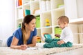 Happy smiling family drawing together on floor Royalty Free Stock Photo