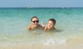 Happy smiling family having fun on tropical white beach Maldives islands. Mother and cute son. Positive human emotions, feelings Royalty Free Stock Photo