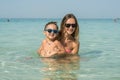 Happy smiling family having fun on tropical white beach Maldives islands. Mother and cute son. Positive human emotions, feelings Royalty Free Stock Photo