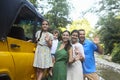 Happy smiling family with kids by the car with mountain river background. Portrait of a smiling family with children in country Royalty Free Stock Photo