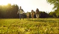 Happy smiling family with kids walking in summer park enjoying beautiful nature. Royalty Free Stock Photo