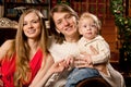 Happy smiling family near the Christmas tree celebrate New Year.