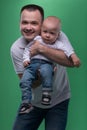 Happy smiling father embracing his baby boy Royalty Free Stock Photo