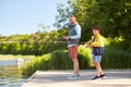 Happy smiling father and son fishing on river Royalty Free Stock Photo