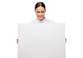 Happy smiling female doctor holding white board Royalty Free Stock Photo