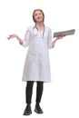 Happy smiling female doctor with stethoscope writing on clipboard Royalty Free Stock Photo