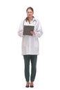 Happy smiling female doctor with stethoscope writing on clipboard Royalty Free Stock Photo