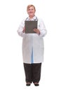 Happy smiling female doctor with stethoscope writing on clipboard Royalty Free Stock Photo