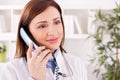 Happy smiling female patient doctor provides consultation to her Royalty Free Stock Photo