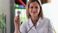 Happy smiling female practitioner showing medical stethoscope